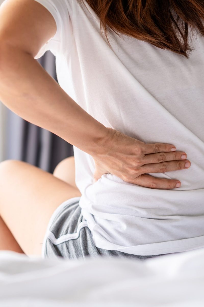 woman-suffering-from-back-ache-on-the-bed-healthc-2021-10-06-09-53-21-utc-min (1)